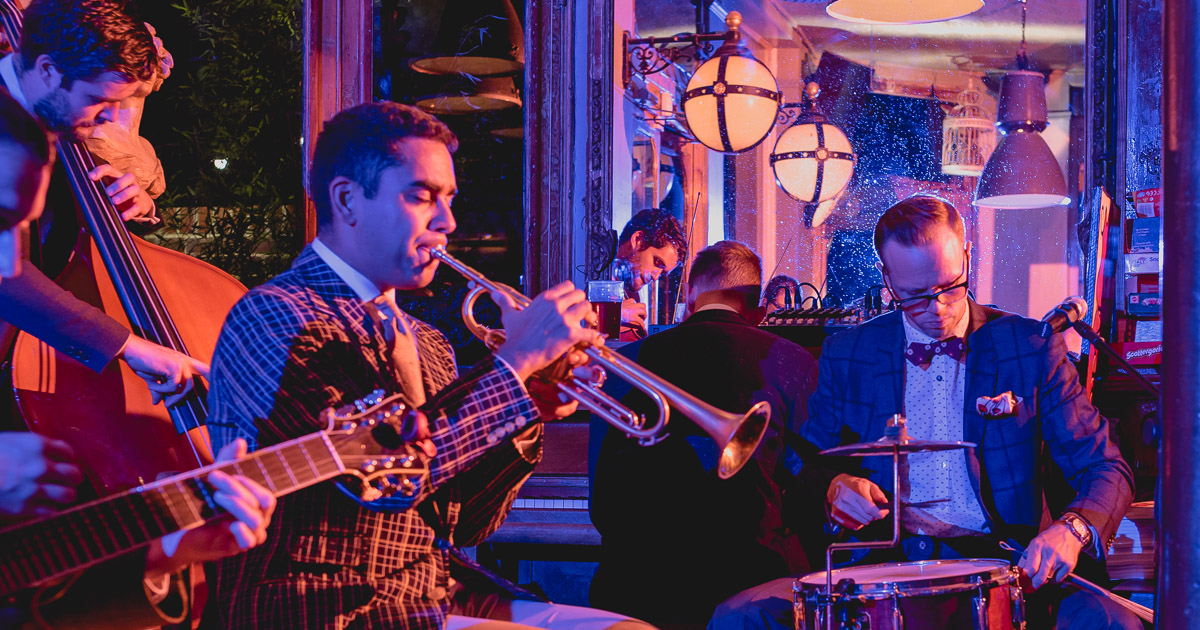 band plays at city wedding by Wilson and Lewis Photography