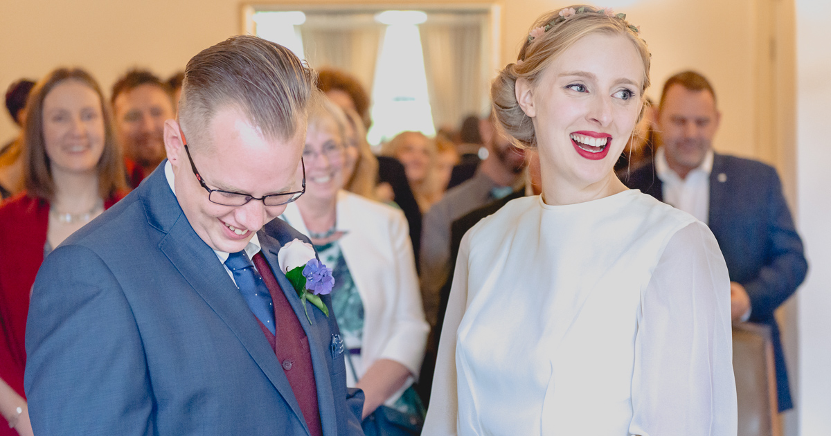 blusing groom at city wedding venue by Wilson and Lewis Photography