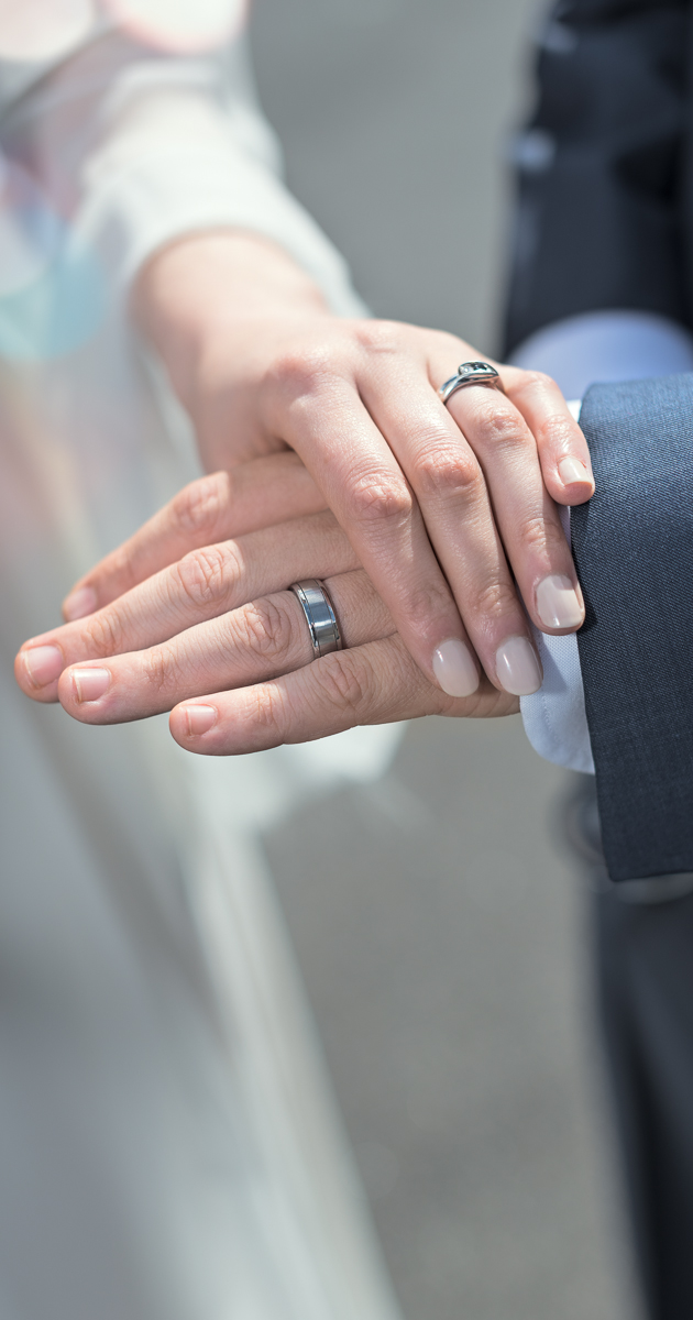 Two wedding rings at a city wedding by Wilson and Lewis Photography
