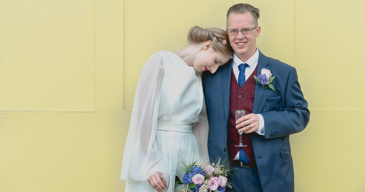 A moment of love at a city wedding by Wilson and Lewis Photography