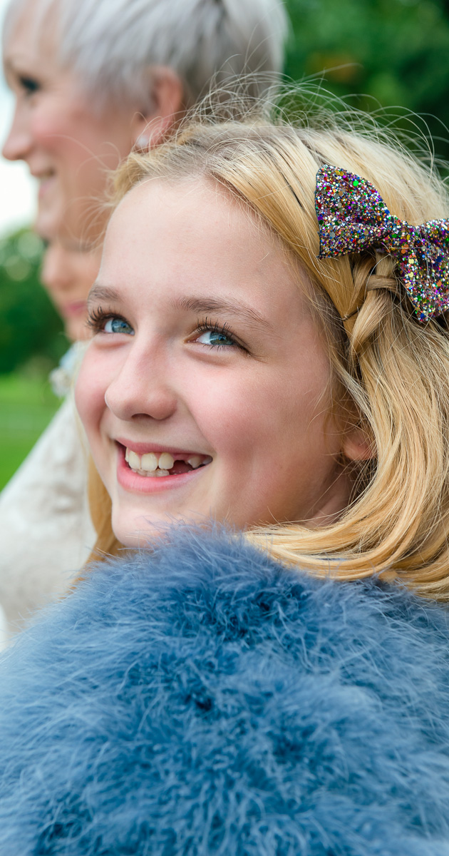 bridesmaid smiling at countryside wedding by Wilson and Lewis Photography