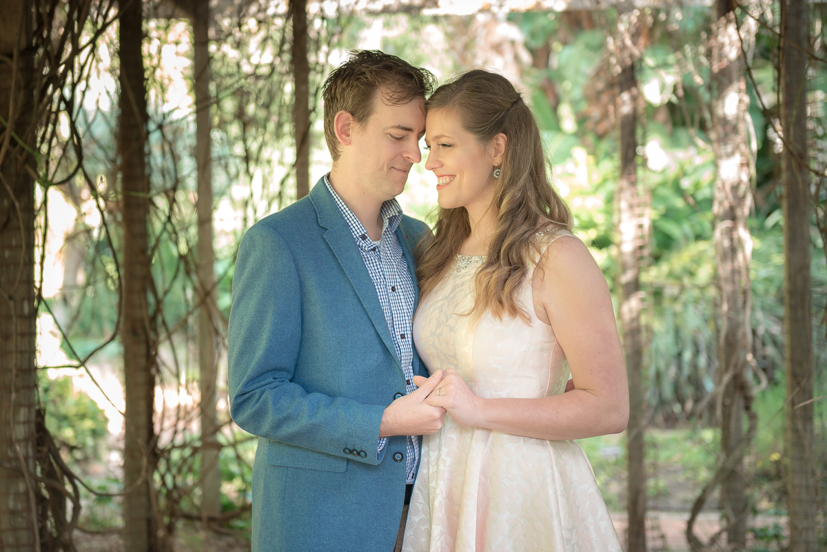 holding hands in garden engagement photos