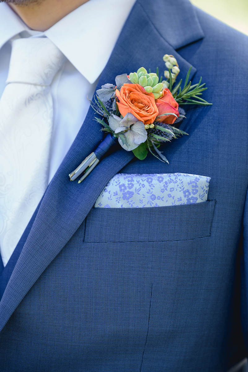 ask your wedding photographers about flower details of button hole