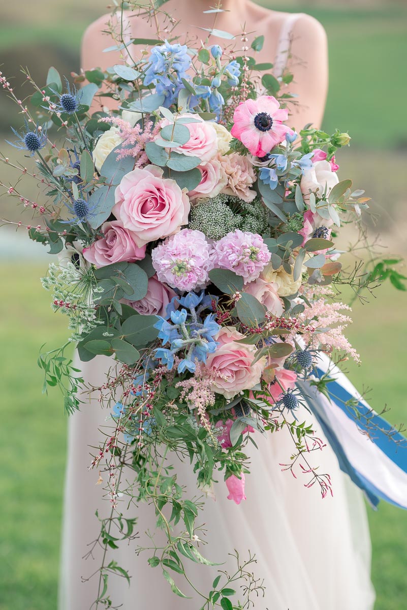 ask your wedding photographers about huge wedding bouquet photos
