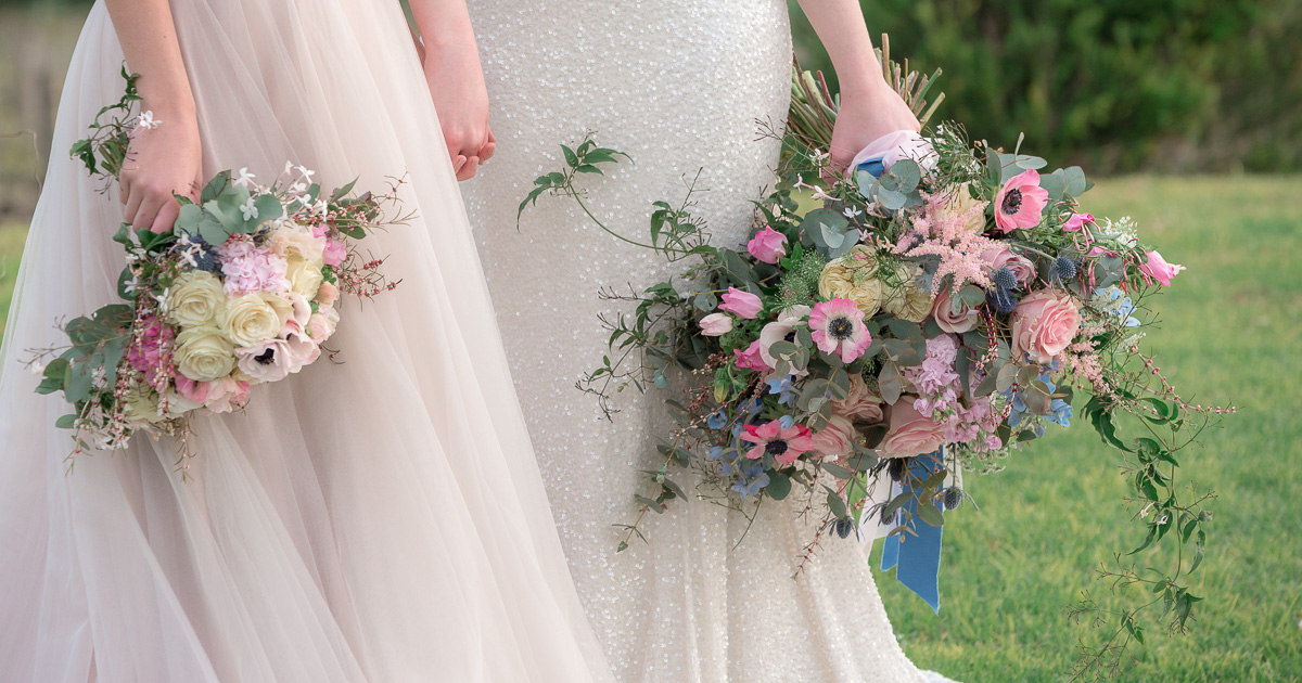 brides with bouquets at same sex wedding
