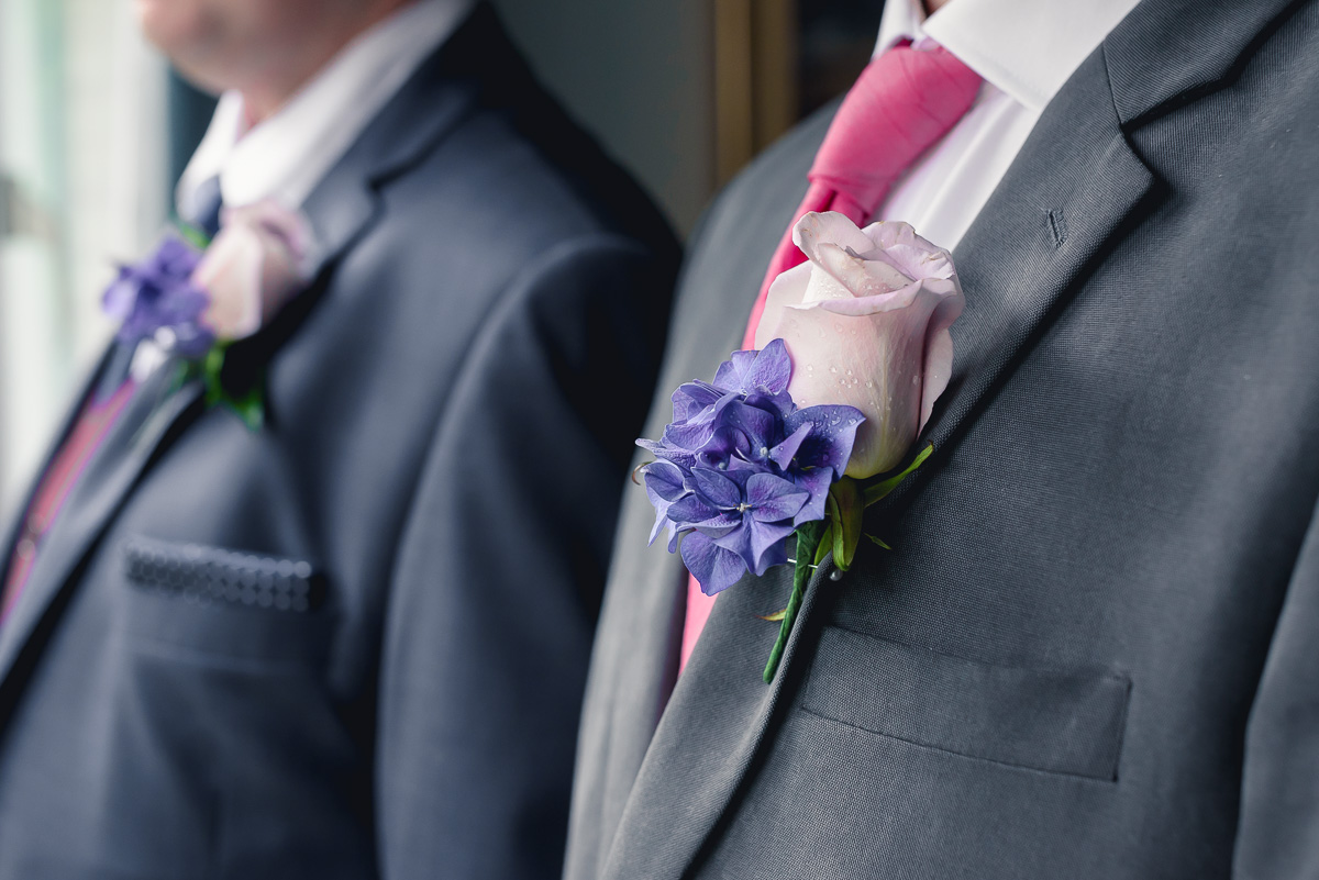 groom and best man choosing a wedding photographer