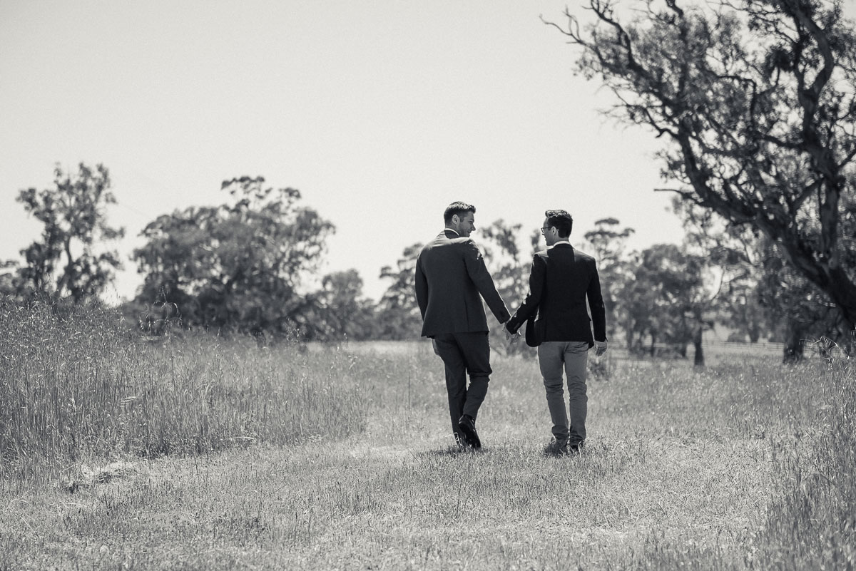 two grooms choosing a wedding photographer