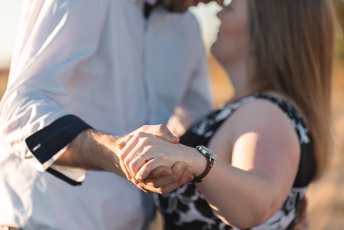 engagement ring on couple at grange