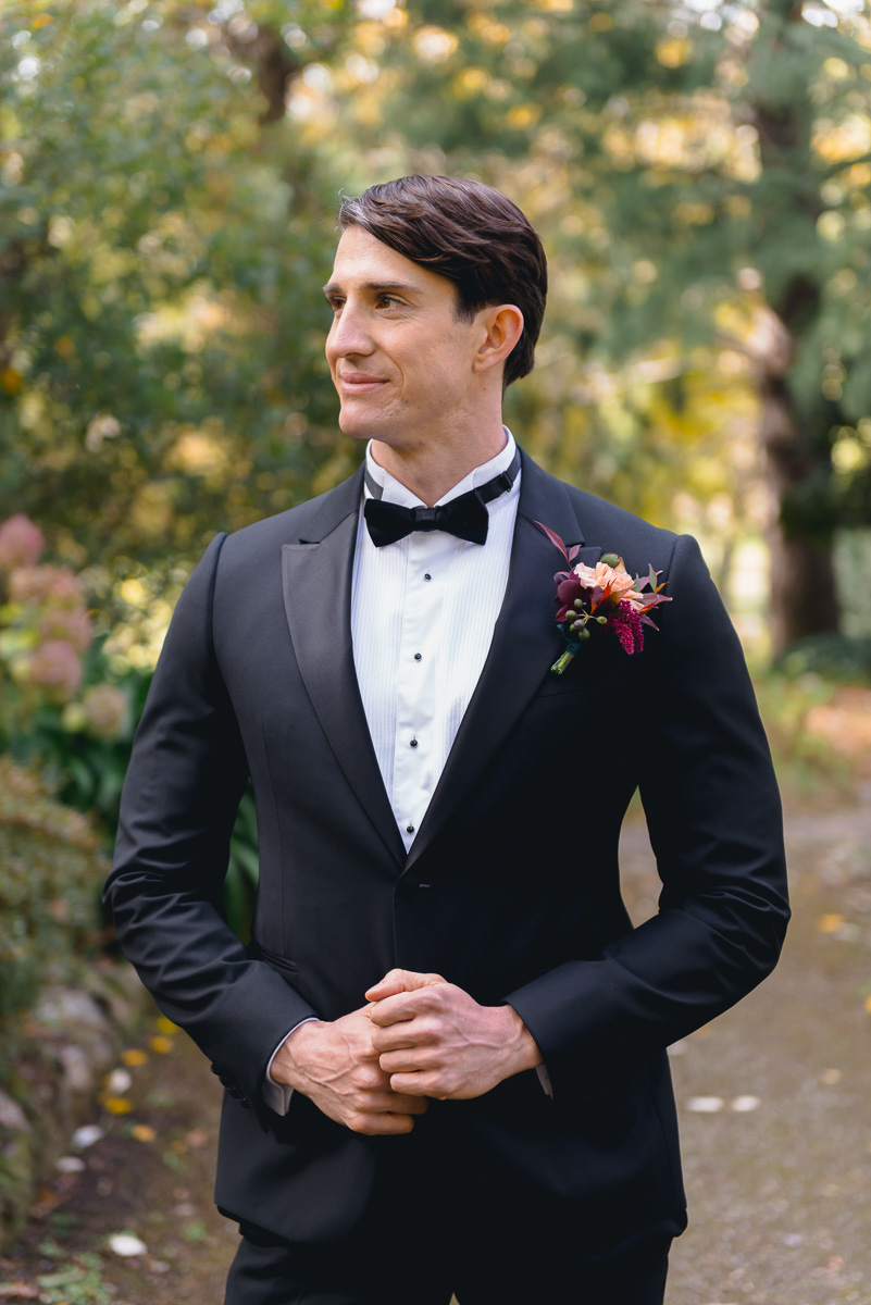 groom posing for wedding photo