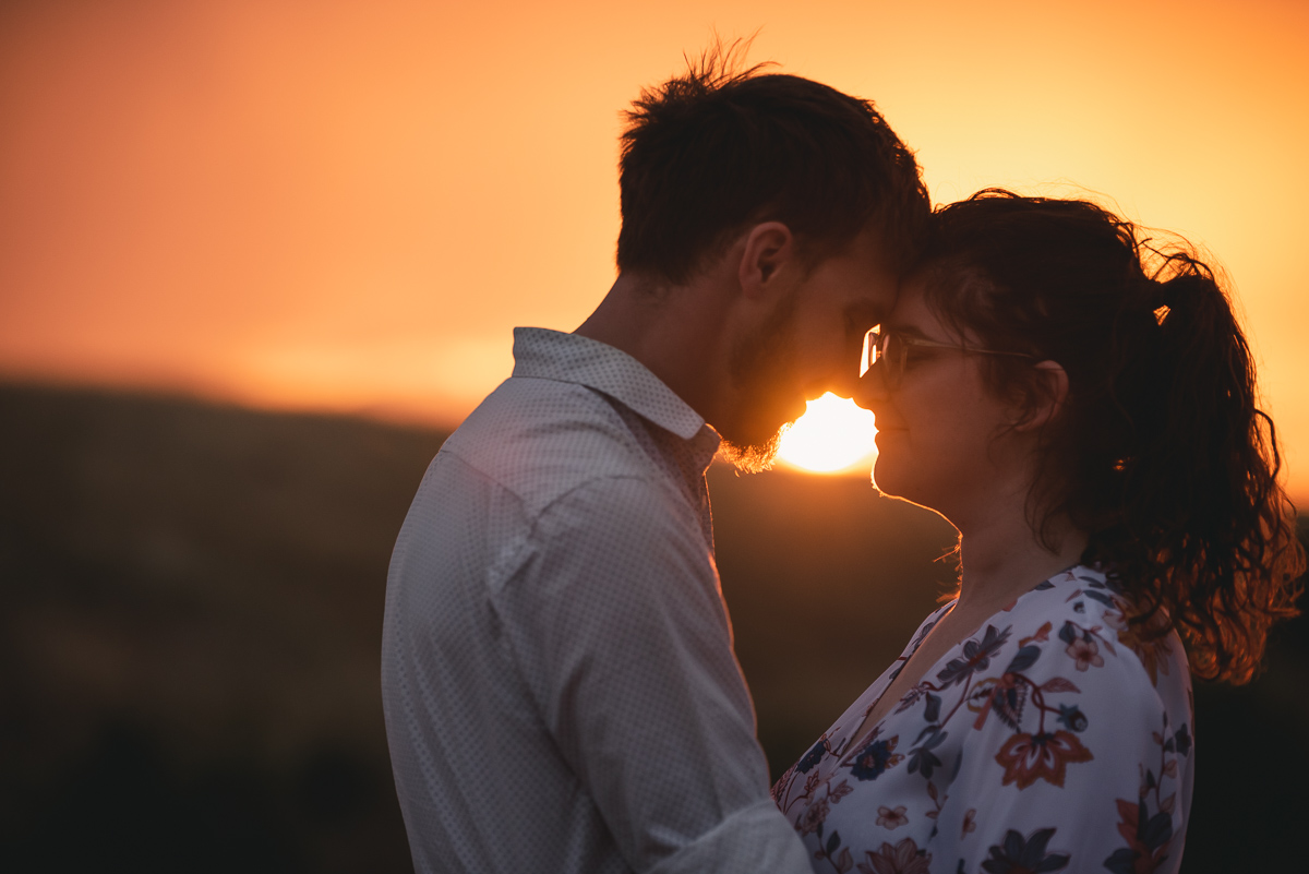 Engaged couple in sunset photography
