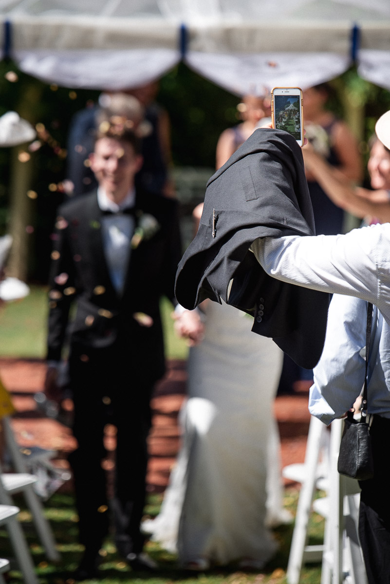 guest ruins wedding photo at unplugged wedding