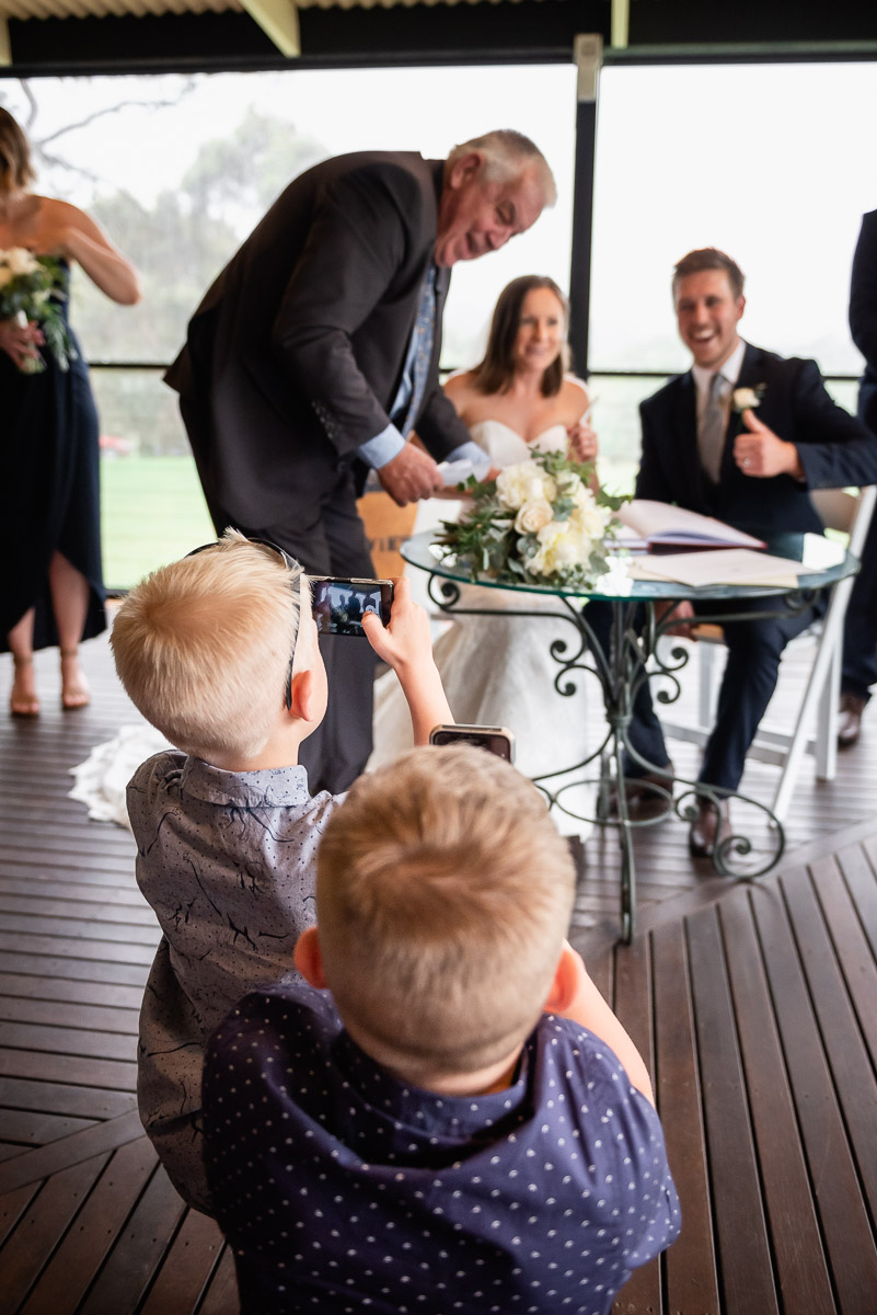 guests take photos at unplugged wedding