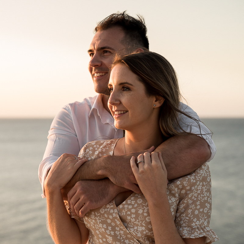 warm embrace during engagement photography session