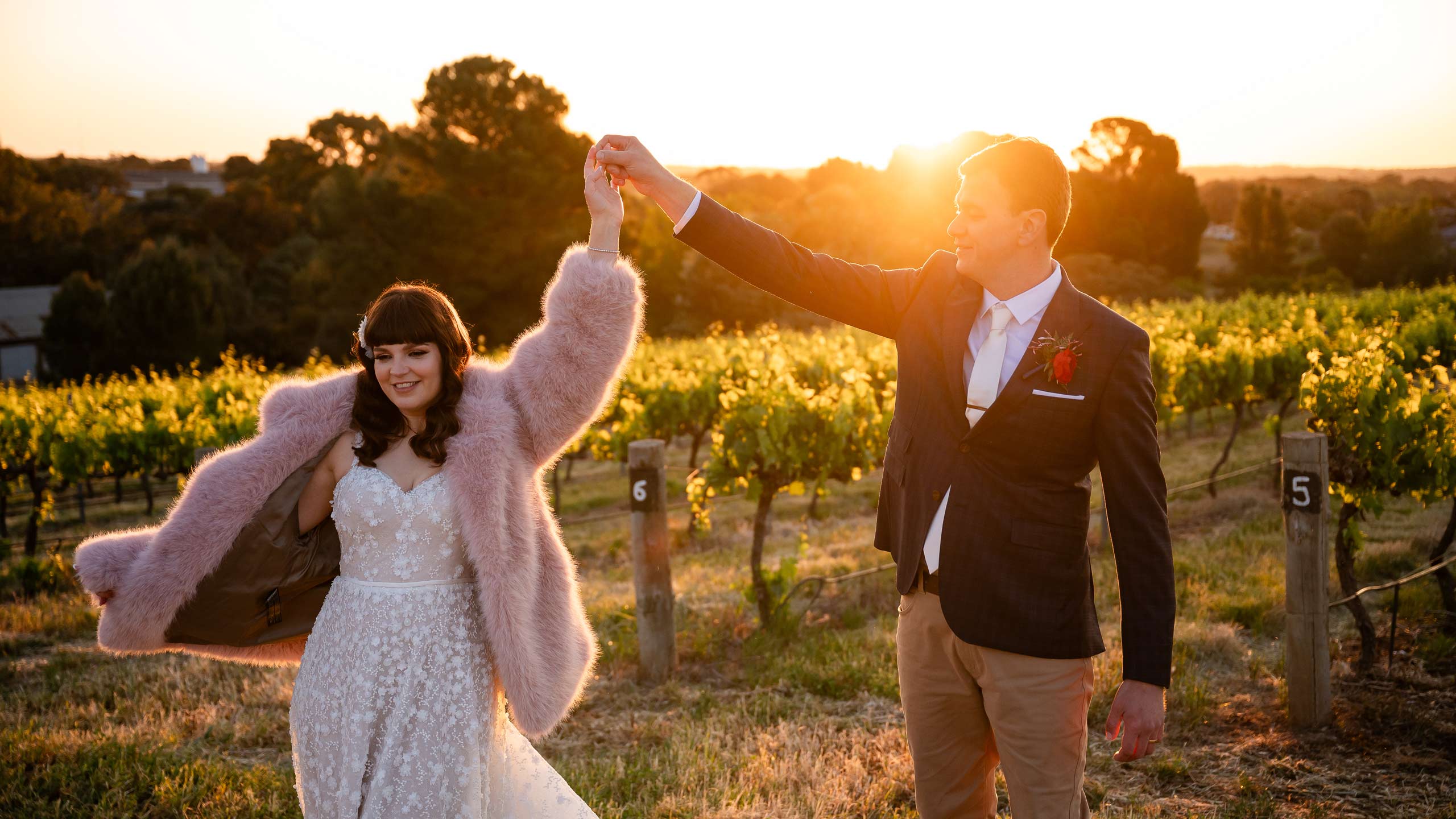 Couples dances at sunset in a vineyard, shot by Adelaide wedding videography team wilson & lewis Photography