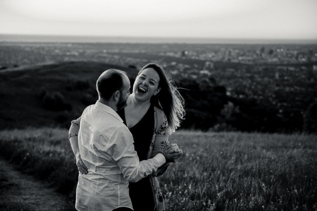Couple laughing by Adelaide engagement photographer Wilson and Lewis Photography