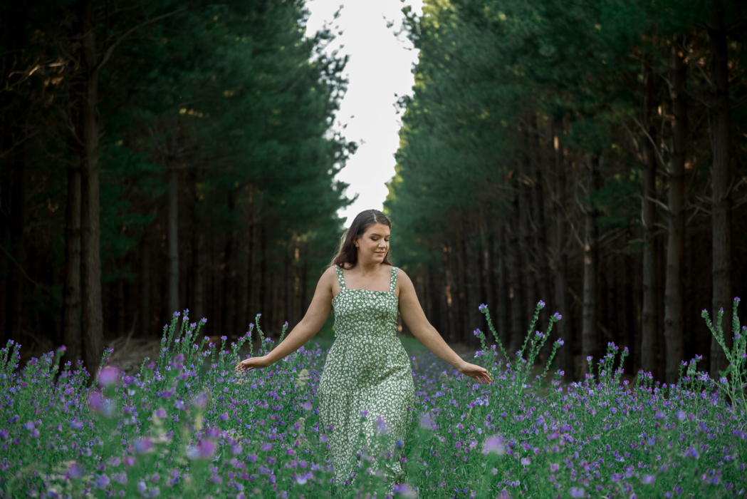 girl in green dress in field by Adelaide engagement photographer Wilson and Lewis Photography