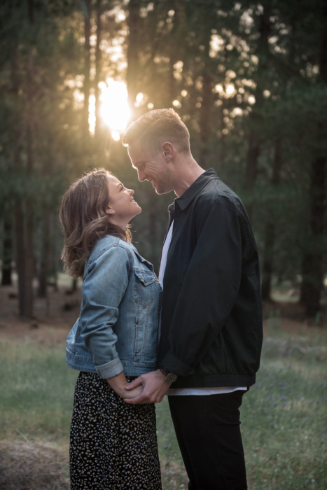 couple with sunflare by Adelaide engagement photographer Wilson and Lewis Photography