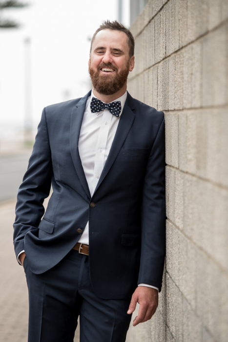 Wedding Groom laughing by Adelaide Wedding photographer Wilson and Lewis Photography