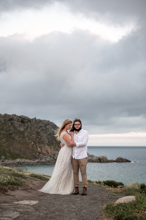 wedding couple at pretrel cove by Adelaide Wedding Photographers Wilson & Lewis Photography