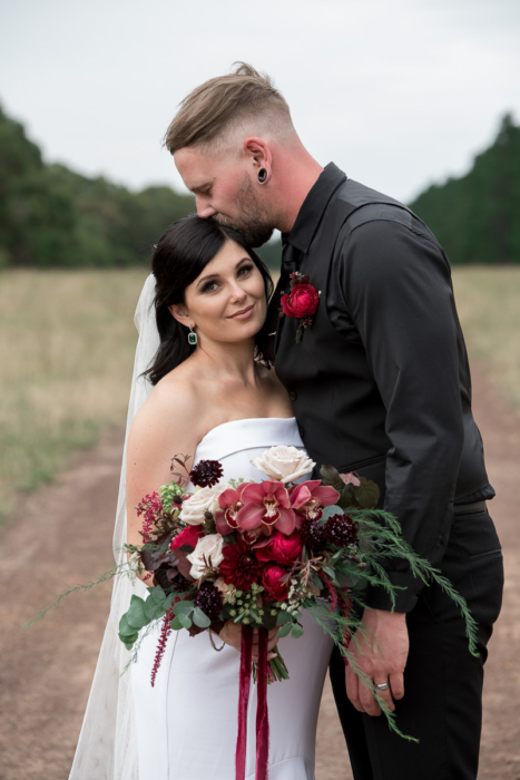 bridal portrait with red flowers