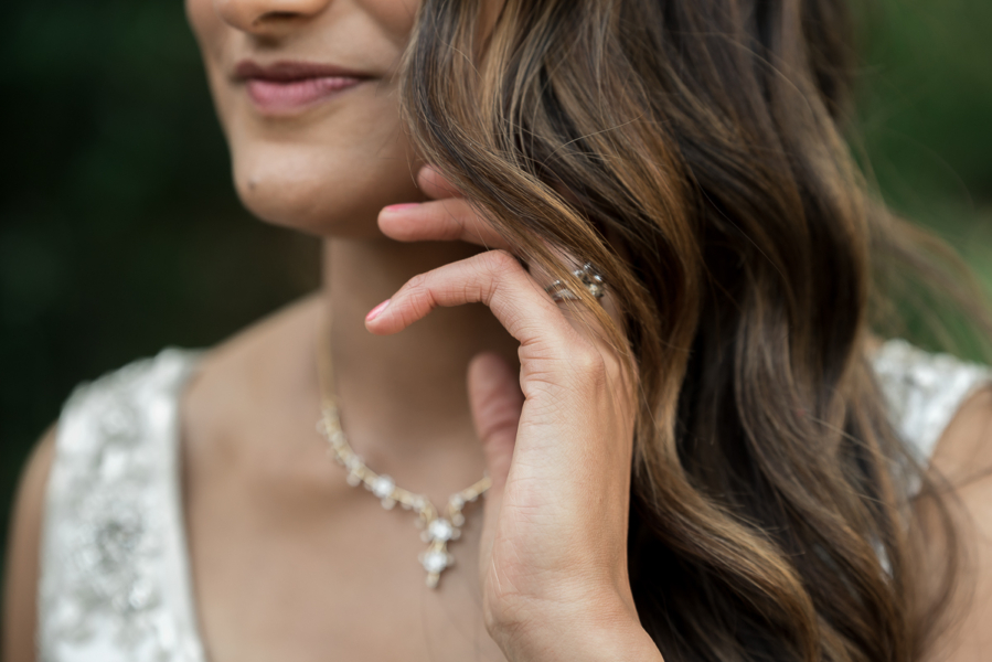 bride sweeping hair from face at Adelaide elopement