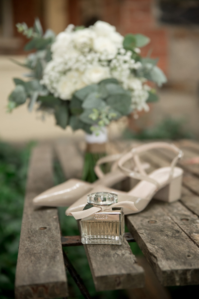 Purfume, shoes and floral bouqute at wedding in Willunga