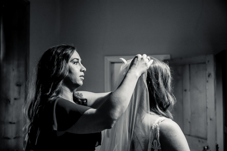 Bride has veil placed