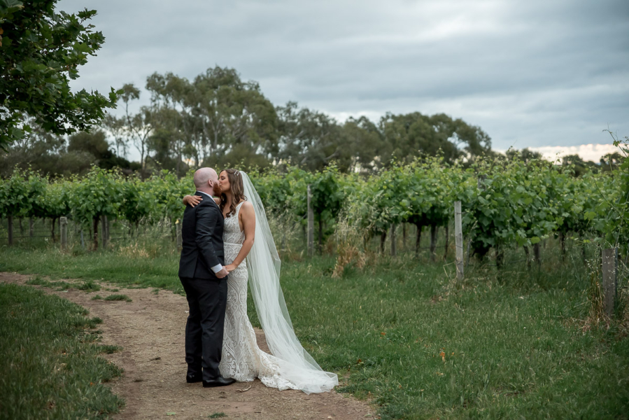 Bride and Groom Kiss near the McLaren Vale vines